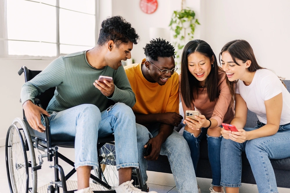 Group of friends watching something on fun and smiling
