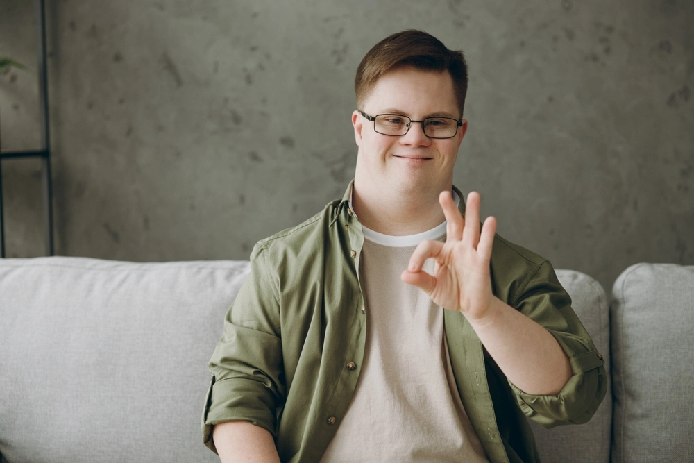 Portrait of a disabled men with down syndrome disability