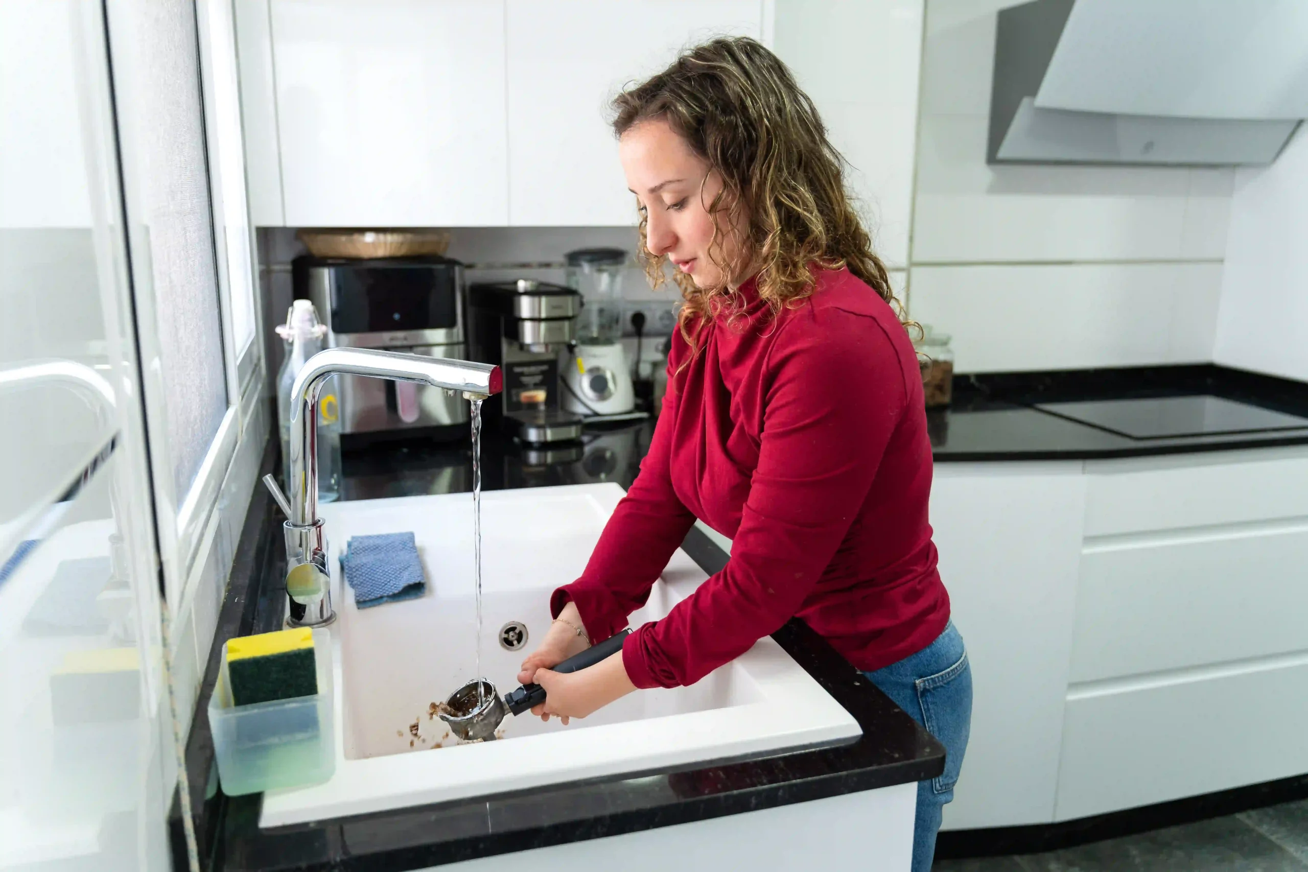 women in kitchen washing dishes