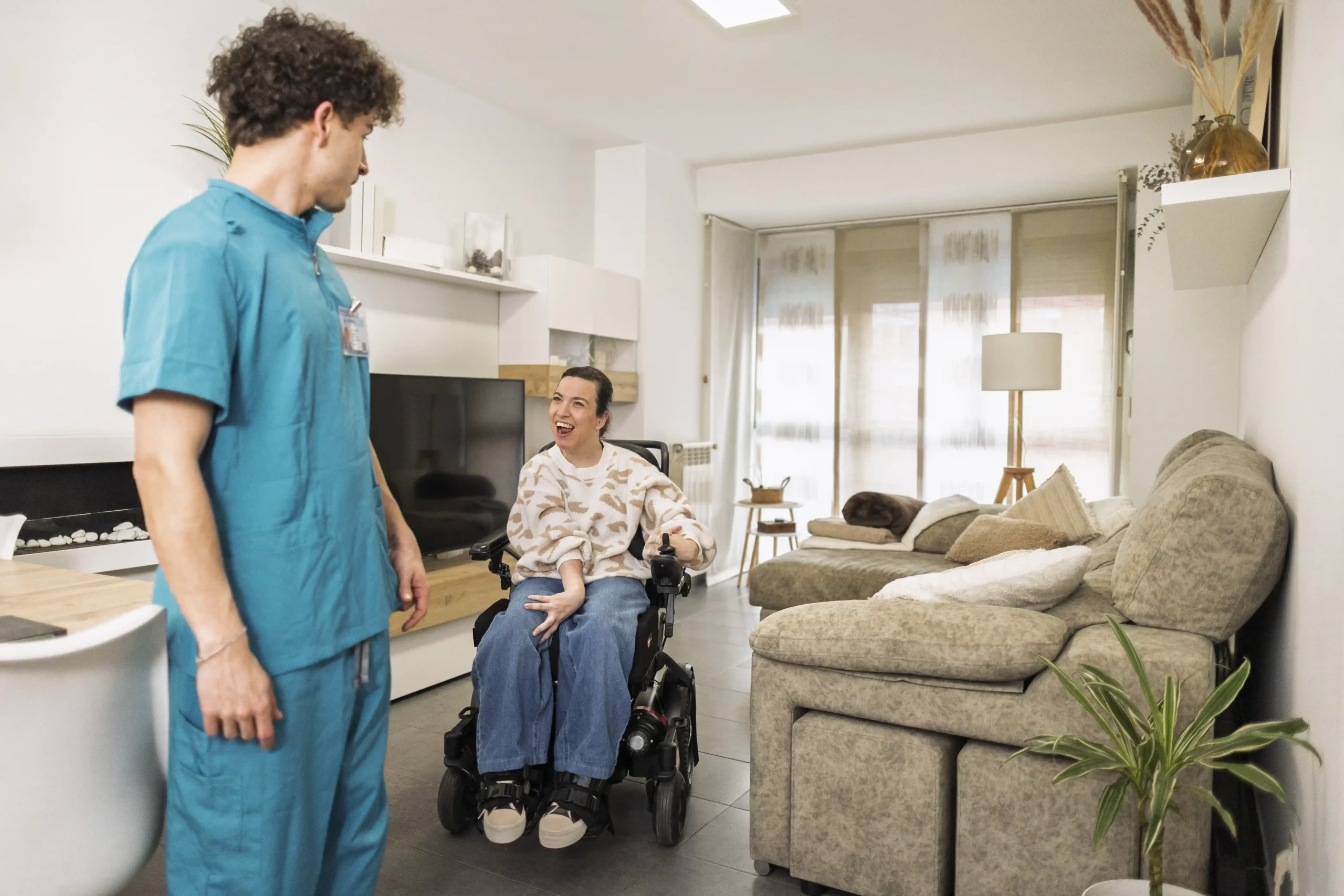 Nurse with a disabled down syndrome participant on wheelchair